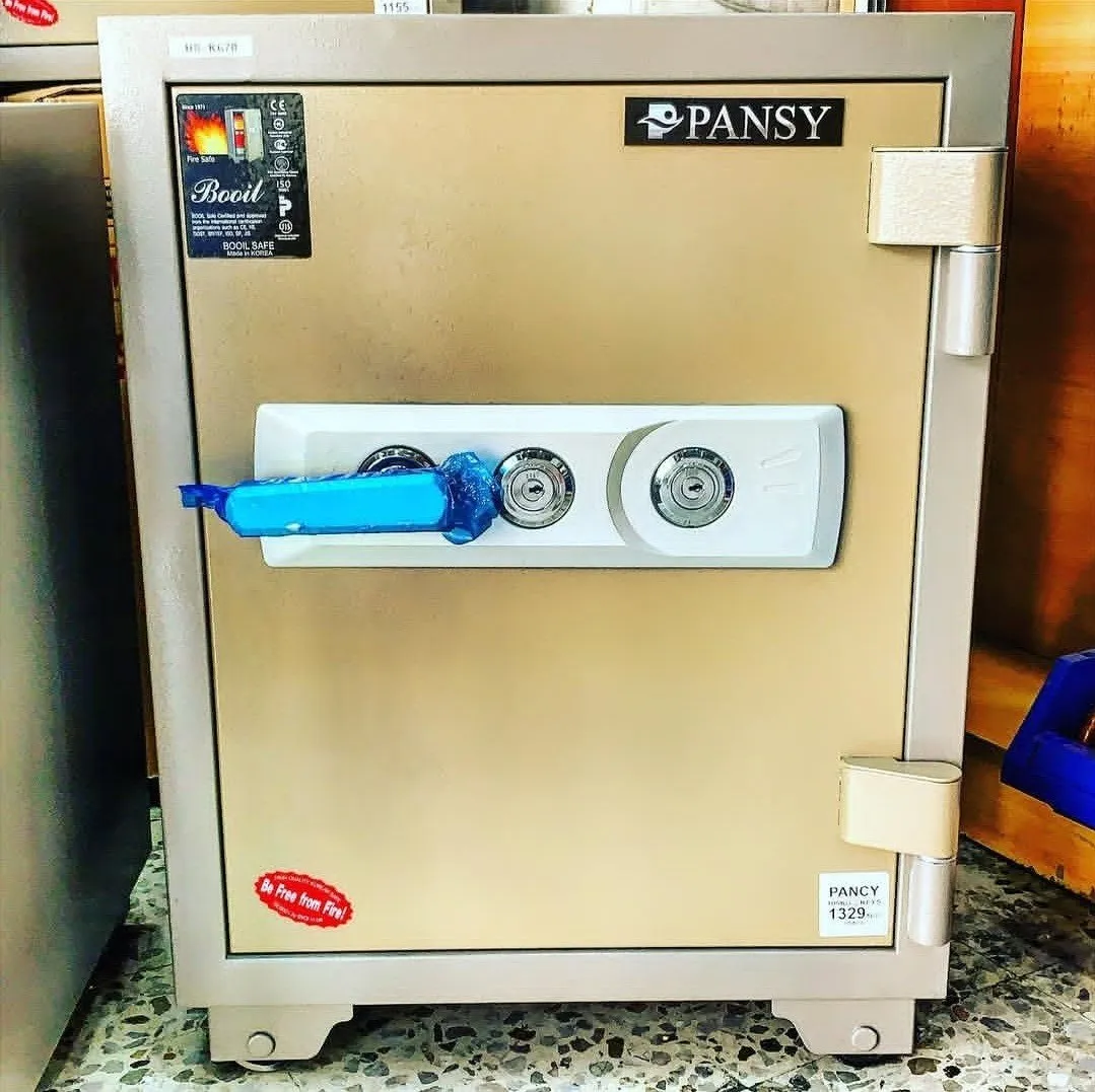 Combination safe box being opened by professional locksmith